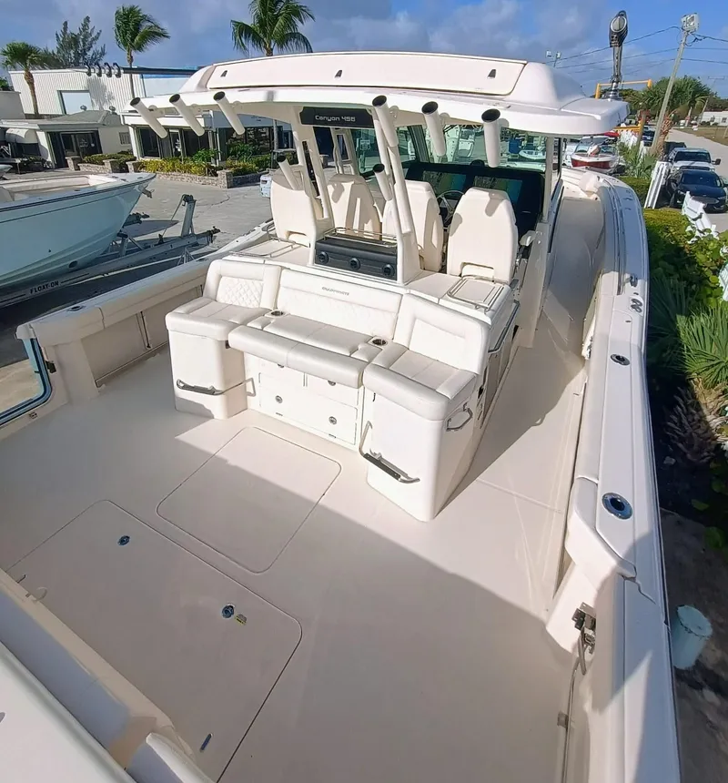 Slide: The Image of 2025 Grady-White Canyon 456 boat with spacious seating and sleek design. - 11