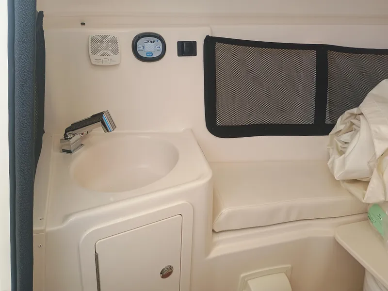 Slide: The Image of Interior of 2025 Grady-White Canyon 456 boat with sink and seating area. - 30