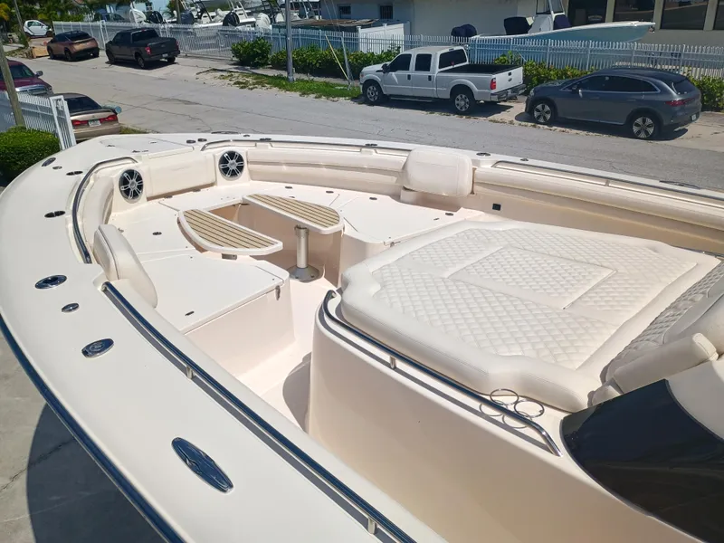 Slide: The Image of 2025 Grady-White Canyon 456 boat with spacious deck and luxurious seating. - 39