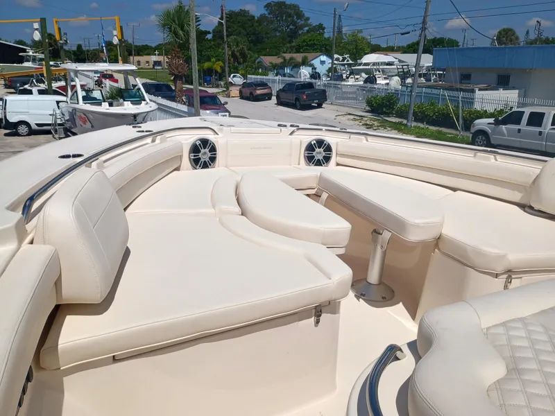 Slide: The Image of 2025 Grady-White Canyon 456 boat interior with luxurious seating and modern design. - 46