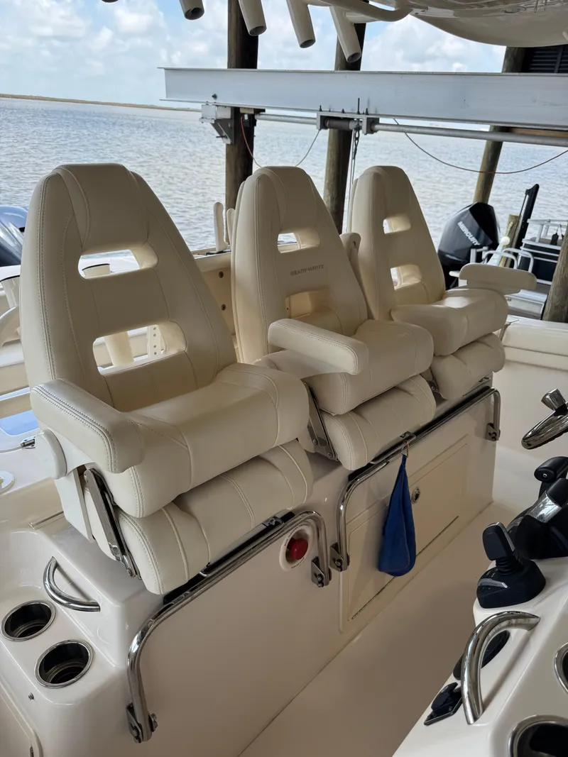 Slide: The Image of 2023 Grady-White Canyon 376 boat with luxurious white seating and ocean view. - 20