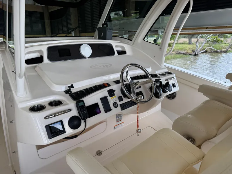 Slide: The Image of 2023 Grady-White Canyon 376 helm with modern controls and comfortable seating. - 26