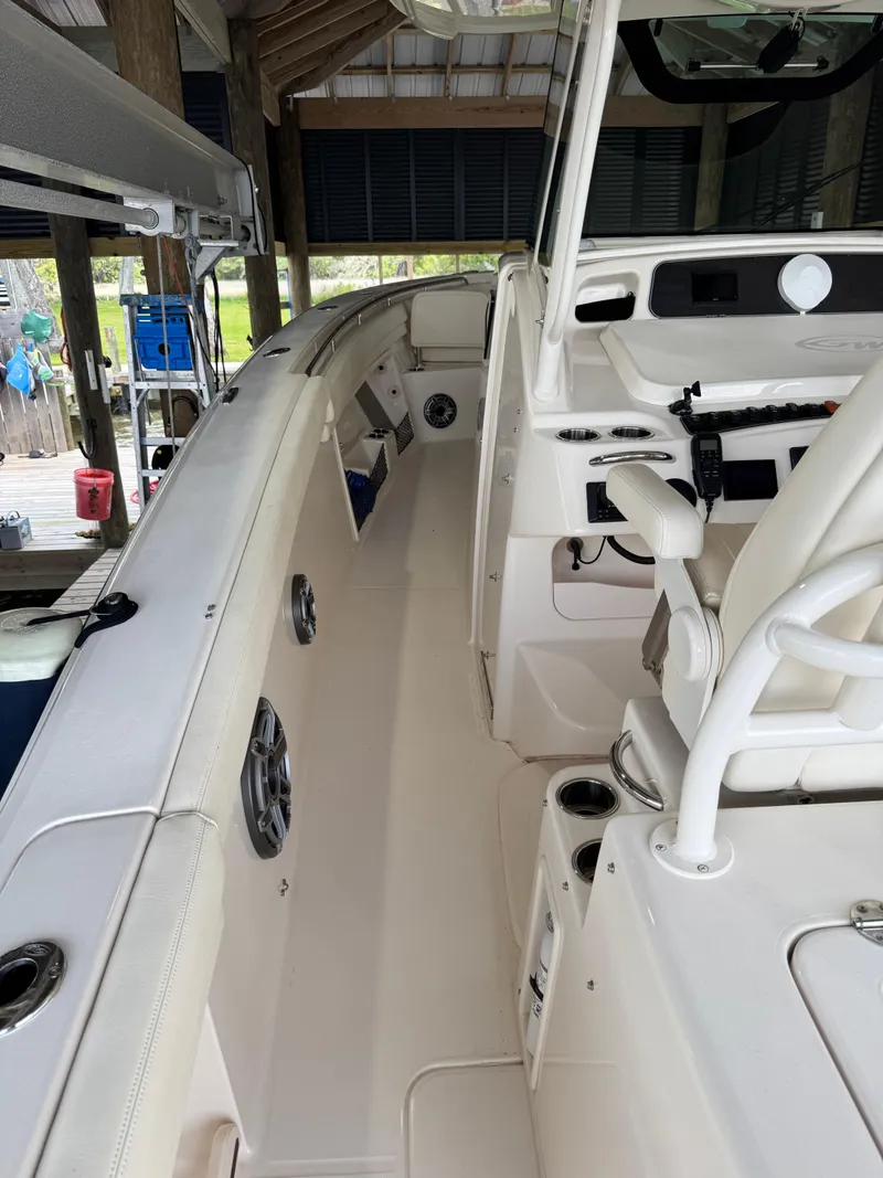 Slide: The Image of 2023 Grady-White Canyon 376 boat interior with helm and seating area. - 27