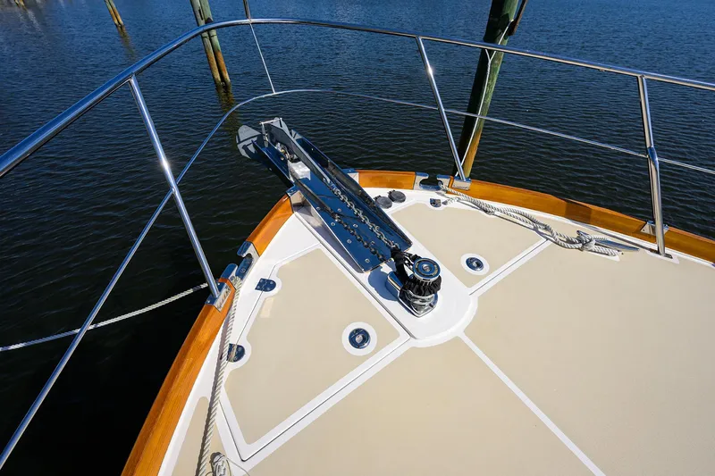 Slide: The Image of Bow of 2014 Grand Banks 46 Eastbay SX yacht with anchor and railing. - 24