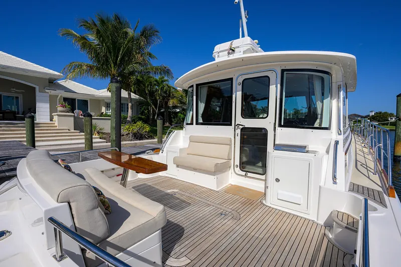 Slide: The Image of 2014 Grand Banks 46 Eastbay SX yacht with spacious deck and seating area. - 29