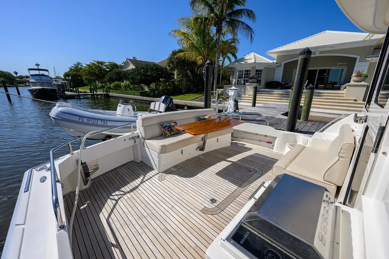 Slide: The Image of Luxurious 2014 Grand Banks 46 Eastbay SX yacht docked by waterfront home. - 35