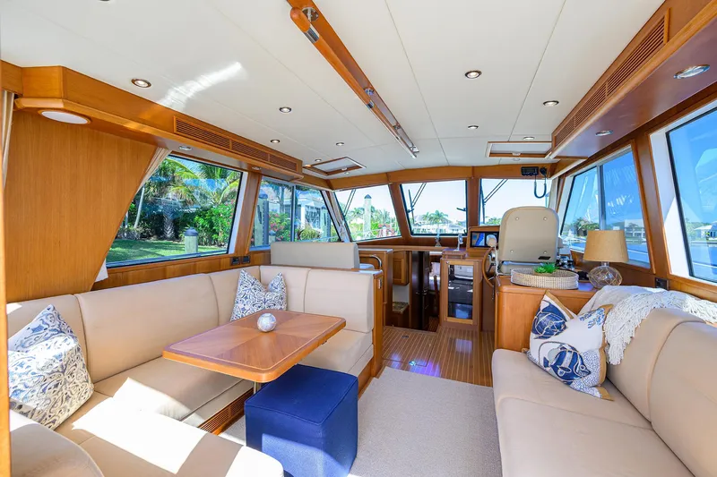 Slide: The Image of Luxurious interior of 2014 Grand Banks 46 Eastbay SX yacht with elegant seating and wood finishes. - 38