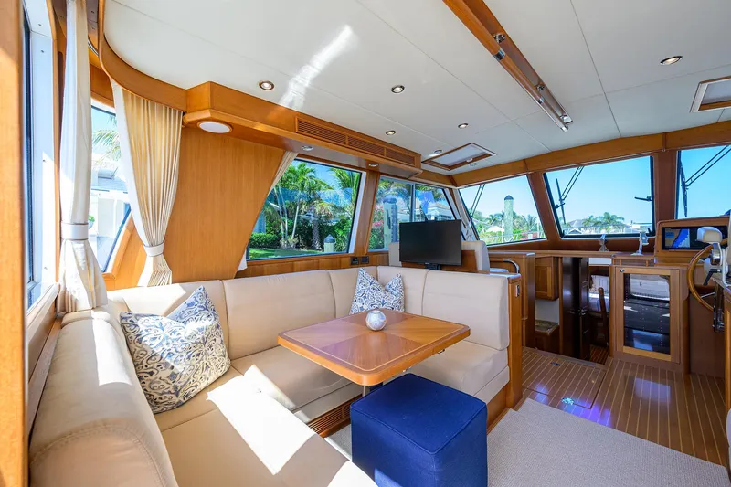 Slide: The Image of Luxurious interior of 2014 Grand Banks 46 Eastbay SX yacht with elegant seating and wood finishes. - 46