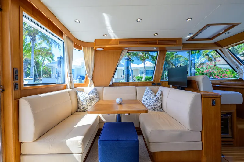 Slide: The Image of Luxurious interior of 2014 Grand Banks 46 Eastbay SX yacht with elegant seating and large windows. - 47