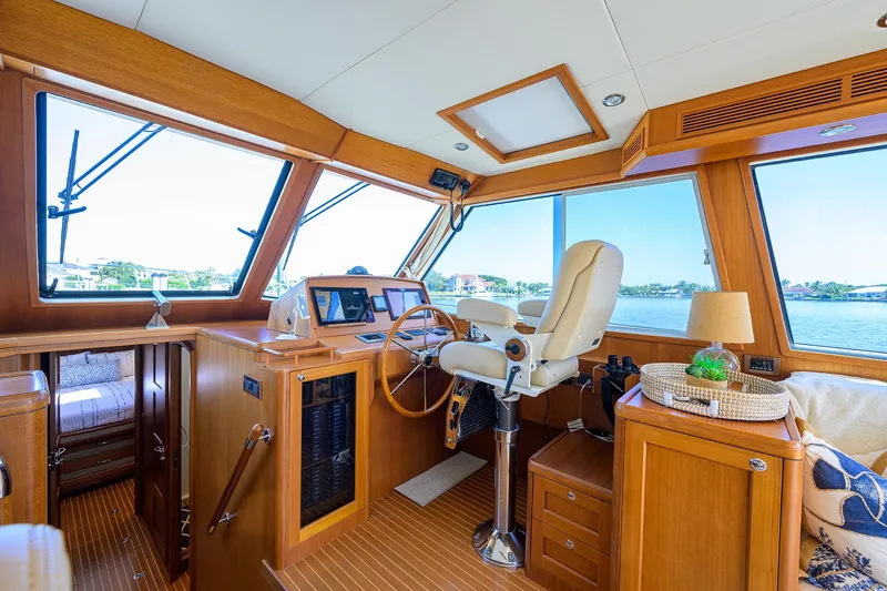 Slide: The Image of Interior of 2014 Grand Banks 46 Eastbay SX yacht, featuring helm and luxurious seating. - 50
