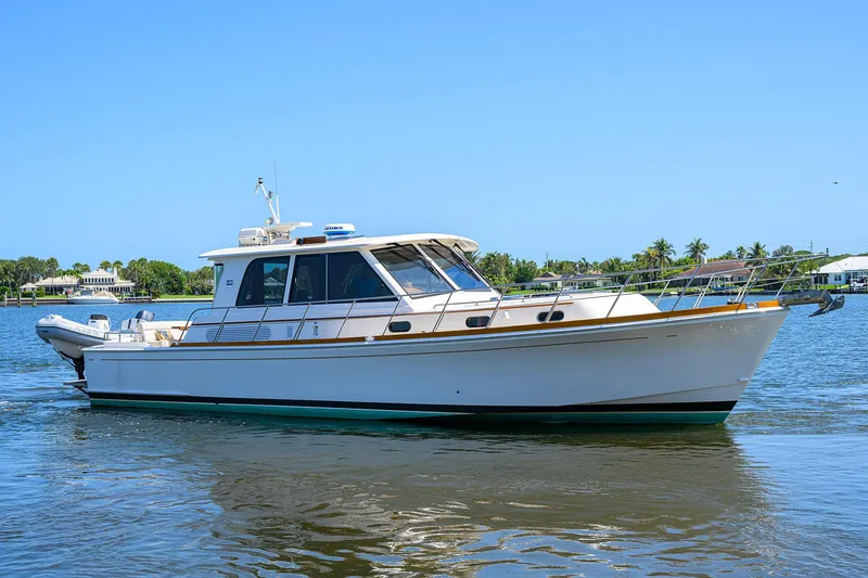 Slide: The Image of 2014 Grand Banks 46 Eastbay SX yacht cruising on a sunny day. - 6