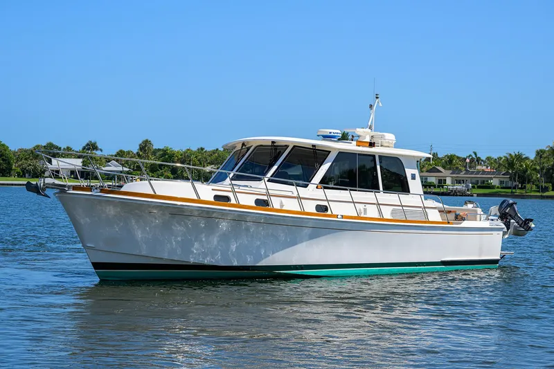 Slide: The Image of 2014 Grand Banks 46 Eastbay SX yacht cruising on a sunny day. - 7