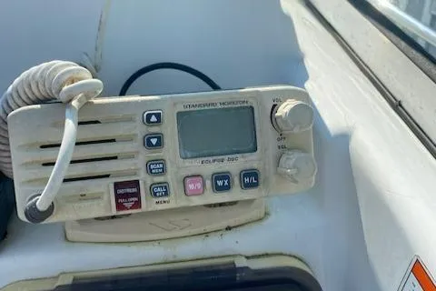 Slide: The Image of Marine radio on 2010 Sea Hunt 225 Victory LE boat dashboard. - 10