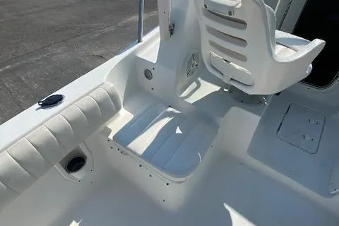 Slide: The Image of 2010 Sea Hunt 225 Victory LE boat interior with white seating and deck. - 14