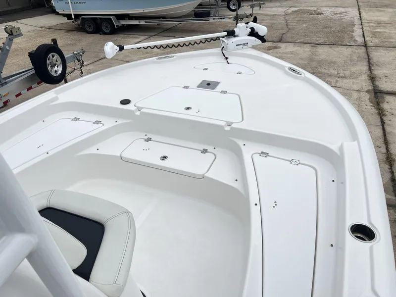 Slide: The Image of 2023 Tidewater 2210 Carolina Bay boat deck with storage compartments and seating. - 11