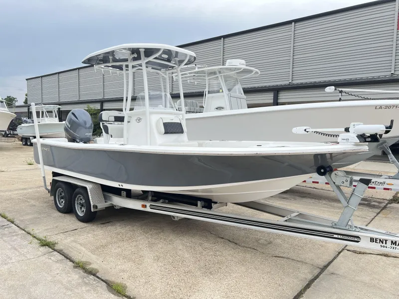 Slide: The Image of 2023 Tidewater 2210 Carolina Bay boat on trailer, parked outdoors. - 3