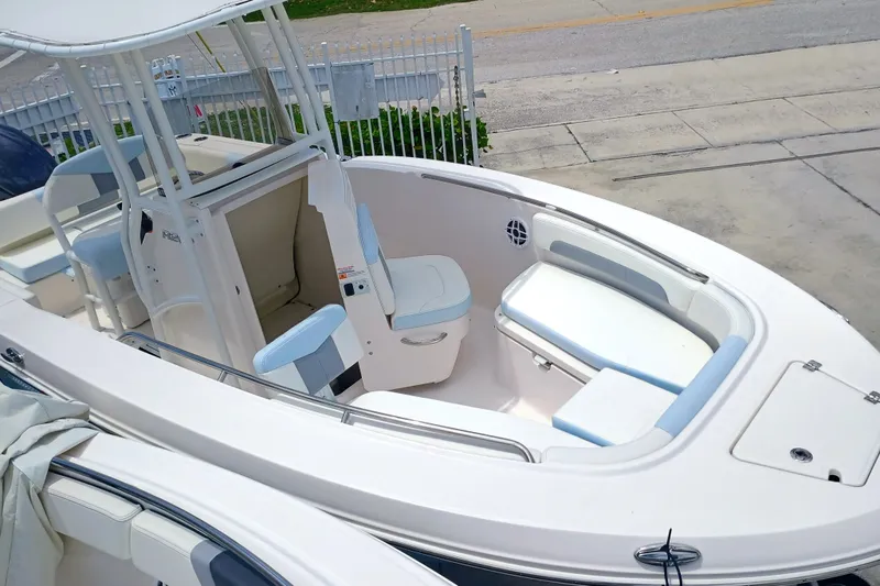 Slide: The Image of 2025 Robalo R202 Explorer boat with spacious seating and modern design. - 11