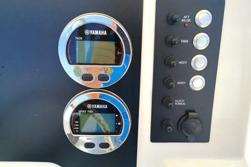 Slide: The Image of Yamaha gauges and control panel on 2025 Robalo R202 Explorer boat dashboard. - 18