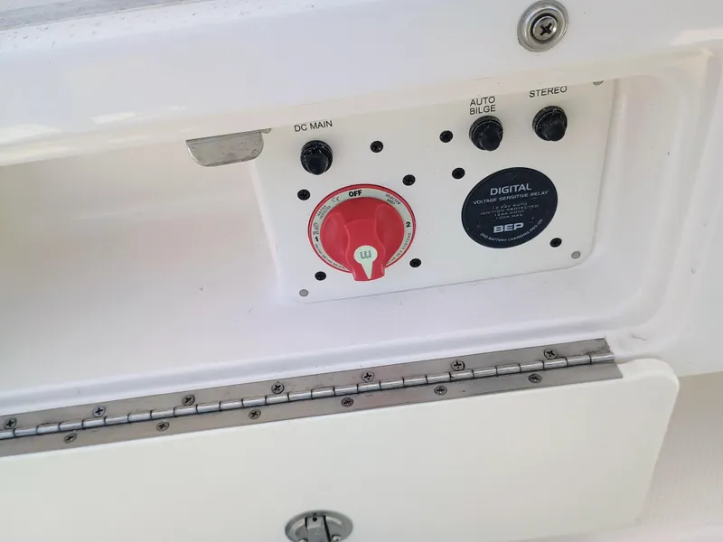 Slide: The Image of Control panel of 2025 Robalo R202 Explorer boat with switches and voltage relay. - 20