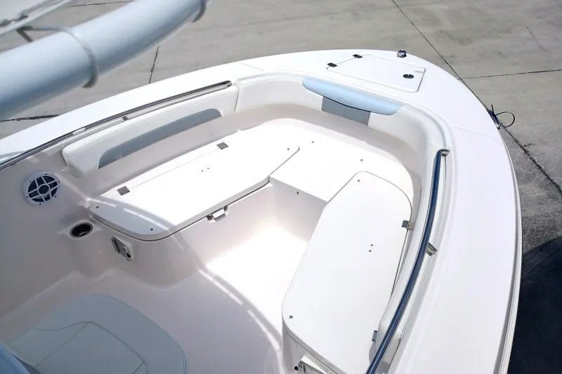Slide: The Image of 2025 Robalo R202 Explorer boat interior with seating and storage compartments. - 8