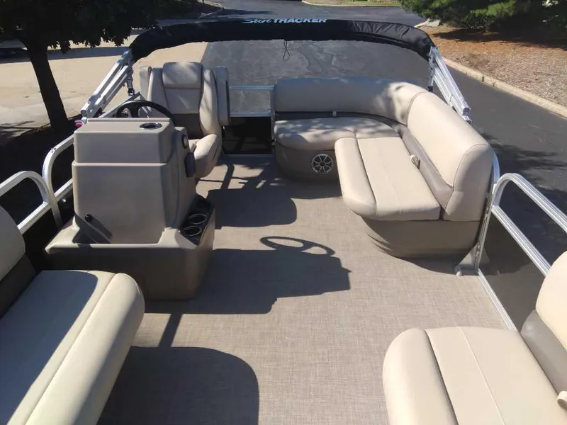 Slide: The Image of 2025 Sun Tracker Party Barge 16 DLX pontoon boat with spacious seating and helm. - 2