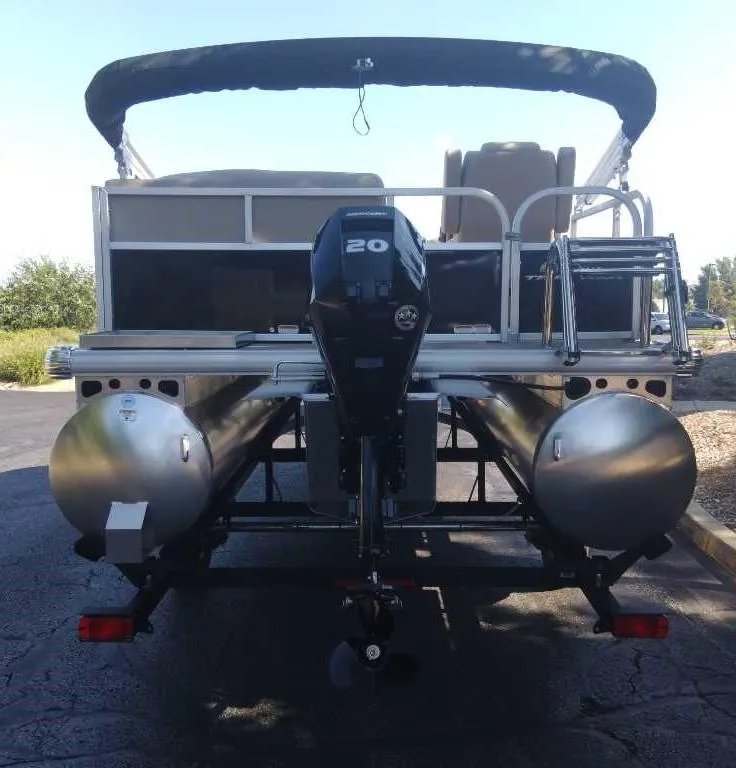 Slide: The Image of 2025 Sun Tracker Party Barge 16 DLX pontoon boat, rear view with motor. - 4