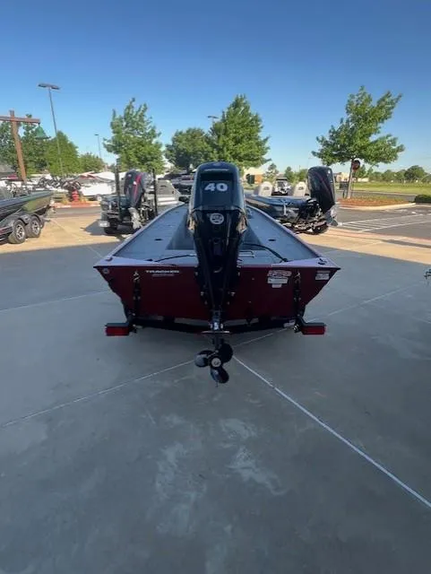 Slide: The Image of 2025 Tracker Panfish 17 boat with 40 HP motor, parked outdoors. - 4