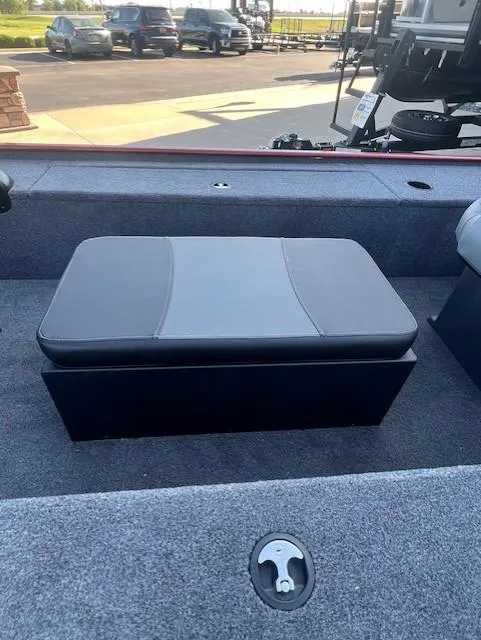 Slide: The Image of 2025 Tracker Panfish 17 boat interior with cushioned seating and carpeted flooring. - 5