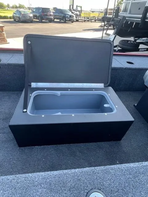 Slide: The Image of 2025 Tracker Panfish 17 boat with open storage compartment on deck. - 6