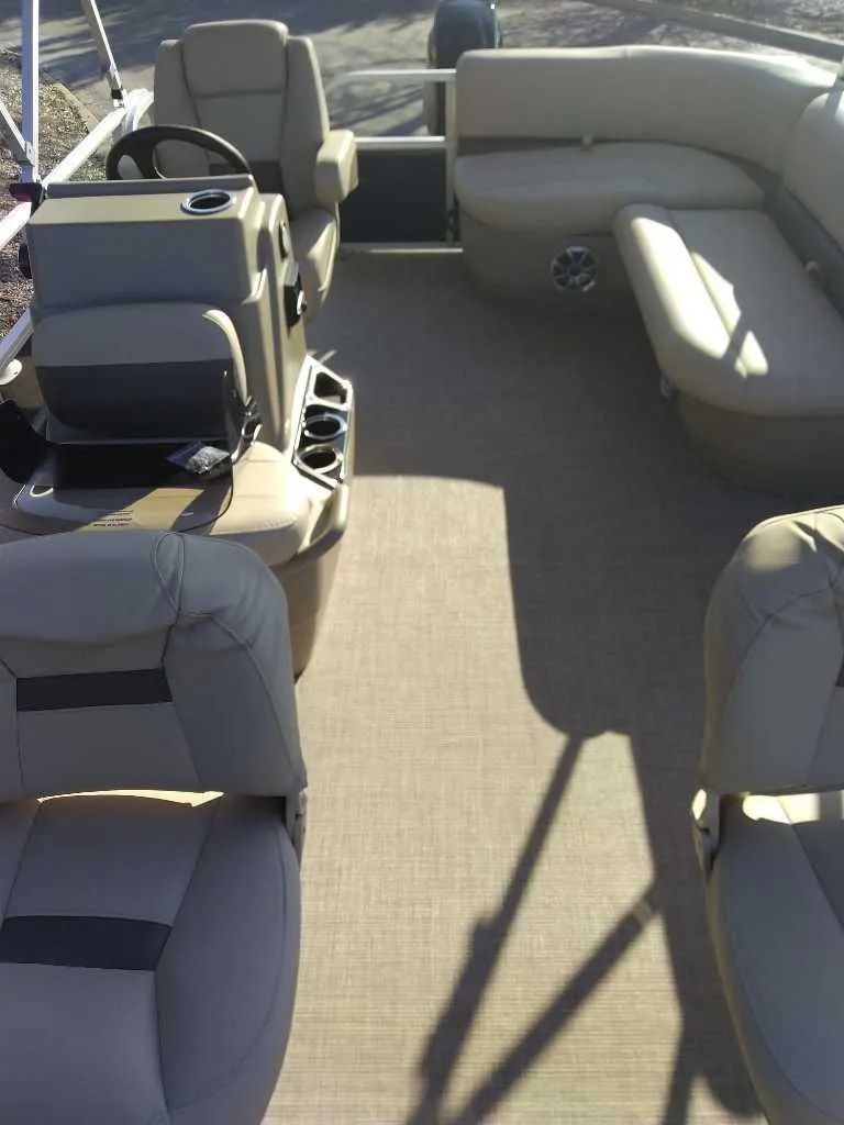 Slide: The Image of 2025 Sun Tracker Bass Buggy 18 DLX pontoon boat interior with spacious seating and modern design. - 3