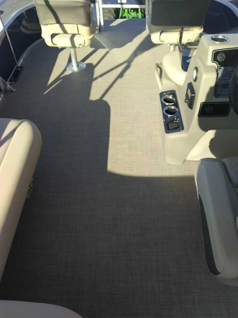 Slide: The Image of 2025 Sun Tracker Bass Buggy 18 DLX interior with seating and control panel. - 4