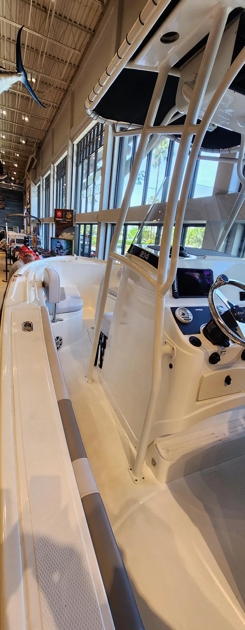 Slide: The Image of 2025 Mako 214 CC boat interior with modern console and seating. - 8