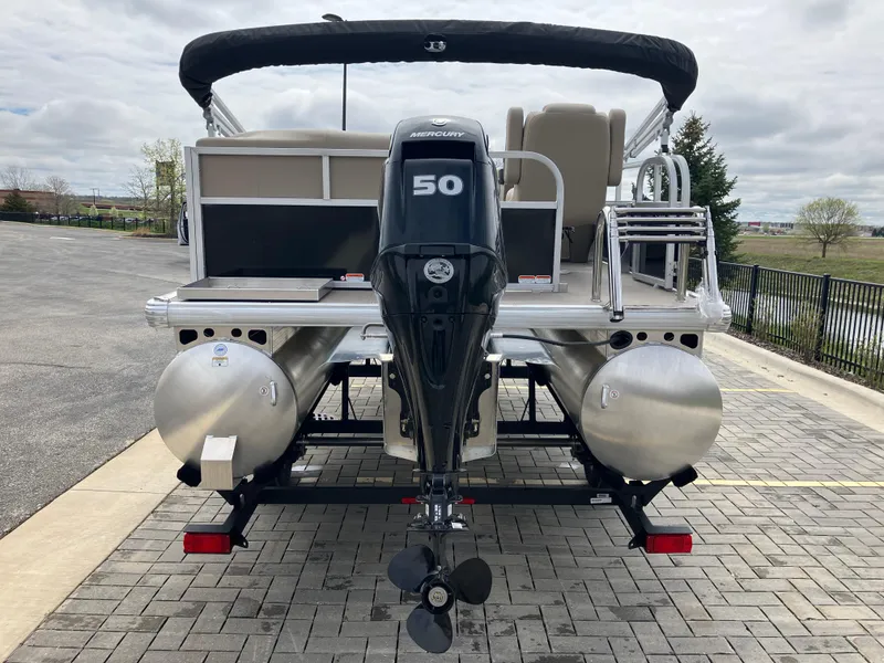 Slide: The Image of 2025 Sun Tracker Party Barge 16 DLX pontoon boat with 50 HP engine, rear view. - 3
