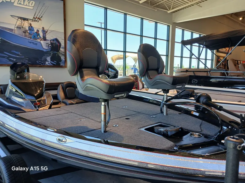 Slide: The Image of 2025 Ranger Z518 boat with elevated seats in a showroom setting. - 11