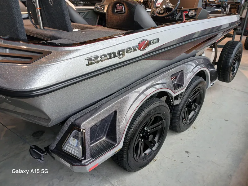Slide: The Image of 2025 Ranger Z518 boat with sleek design and dual-axle trailer. - 20