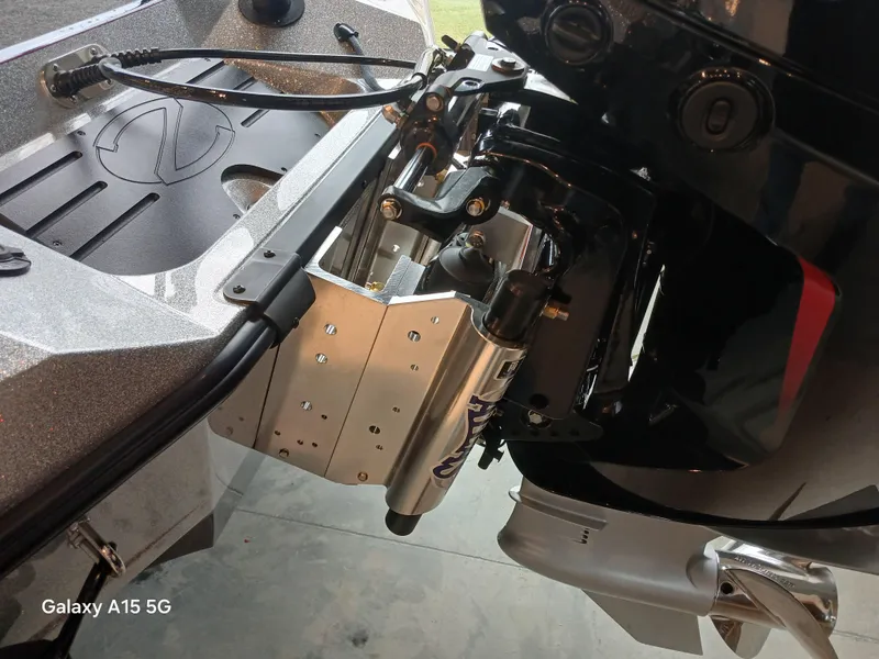 Slide: The Image of 2025 Ranger Z518 boat engine mount detail with hydraulic components. - 23