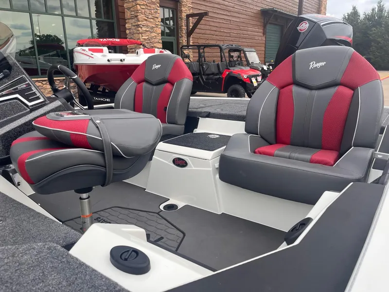 Slide: The Image of 2025 Ranger Z519R boat interior with red and gray seating, showcasing modern design. - 2