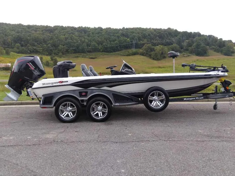 Slide: The Image of 2024 Ranger Z520R Ranger Cup Equipped boat on trailer, parked outdoors. - 0