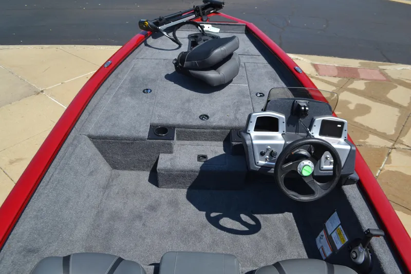 Slide: The Image of 2025 Tracker Pro Team 175 boat interior with steering console and seating. - 3