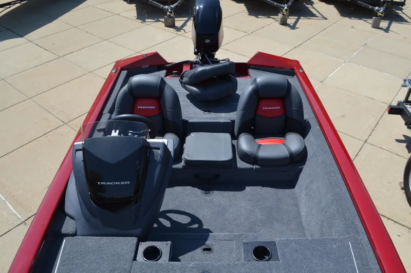 Slide: The Image of 2025 Tracker Pro Team 175 boat interior with dual seats and steering console. - 4