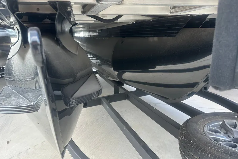 Slide: The Image of Underneath view of 2024 Regency 230 LE3 pontoon boat on trailer. - 14