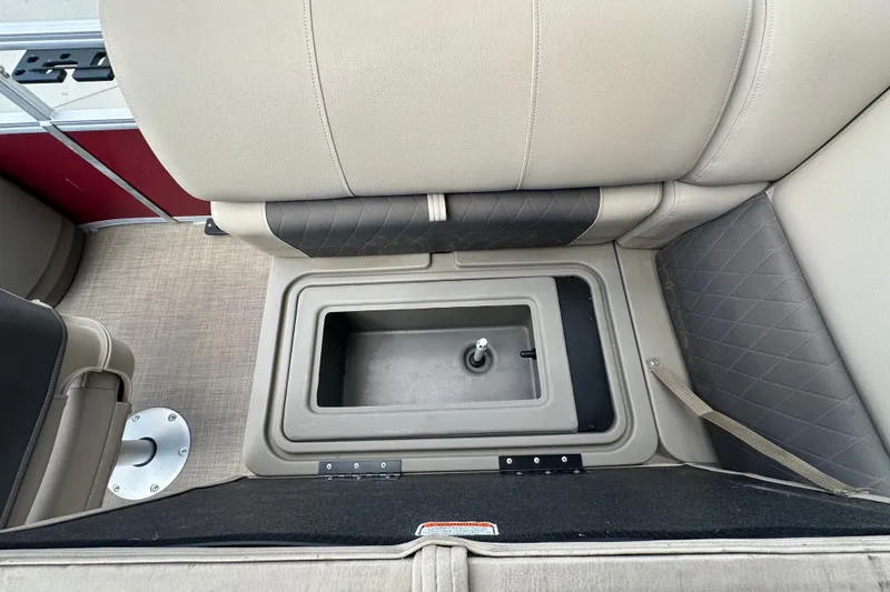 Slide: The Image of 2024 Regency 230 LE3 boat seat with integrated storage compartment. - 12