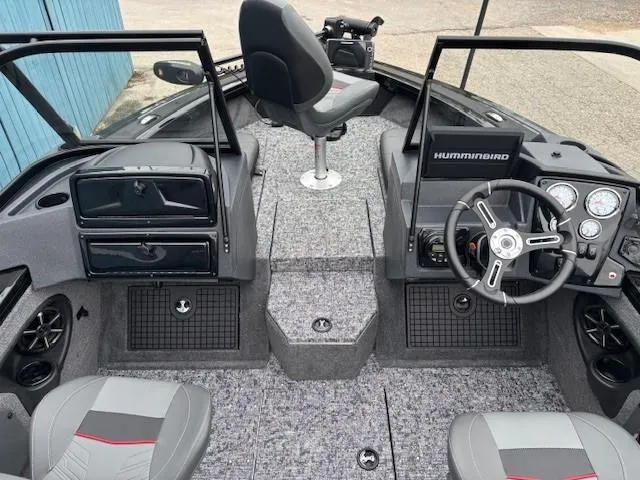 Slide: The Image of 2025 Tracker Targa V-19 Combo boat interior with steering wheel, seats, and control panel. - 12