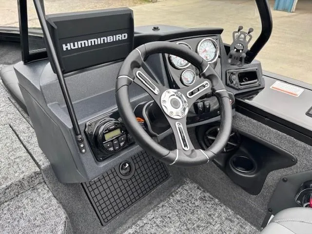 Slide: The Image of 2025 Tracker Targa V-19 Combo boat dashboard with steering wheel and Humminbird electronics. - 15