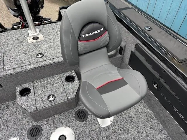 Slide: The Image of 2025 Tracker Targa V-19 Combo boat seat with gray upholstery and red accents. - 27