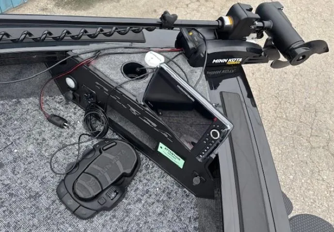 Slide: The Image of 2025 Tracker Targa V-19 Combo boat dashboard with Minn Kota trolling motor and control panel. - 8