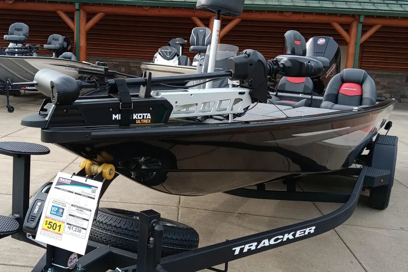 The Image of 2025 Tracker Savage 215 boat on display with Minn Kota trolling motor. - 0