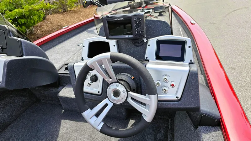 Slide: The Image of 2025 Tracker Pro Team 175 boat dashboard with steering wheel and electronic displays. - 7