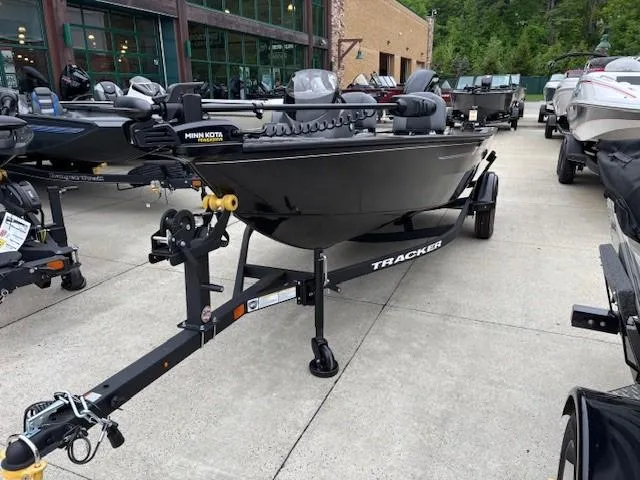 Slide: The Image of 2025 Tracker Super Guide V-16 SC boat on trailer, displayed outdoors. - 2