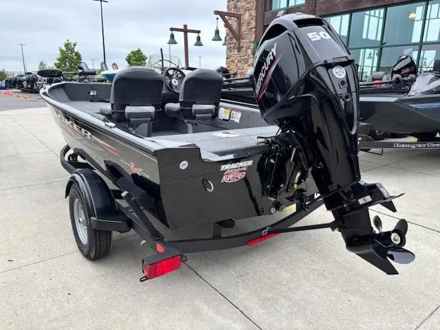 Slide: The Image of 2025 Tracker Super Guide V-16 SC boat with Mercury engine on trailer. - 3